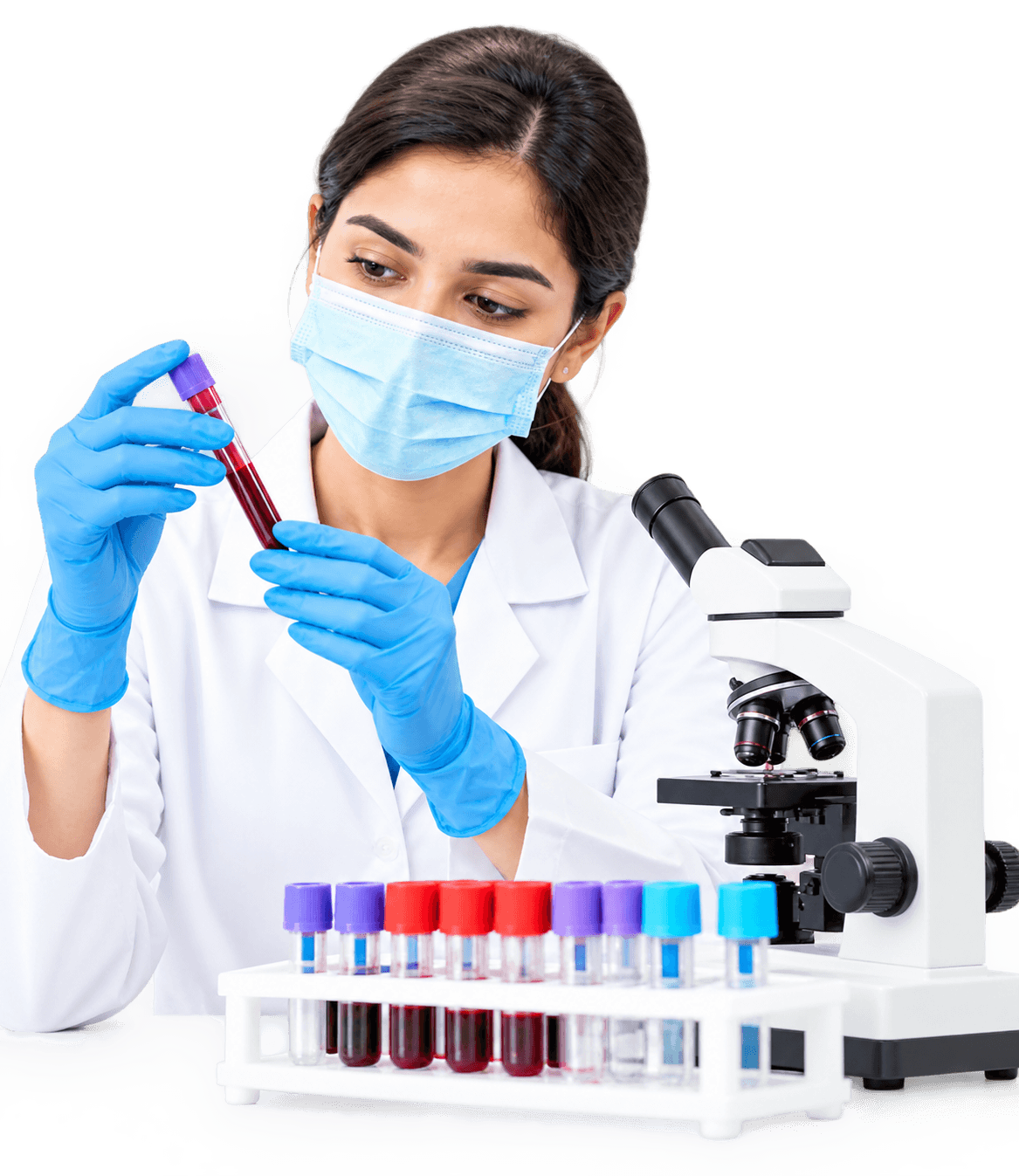Masked scientist examining a blood sample